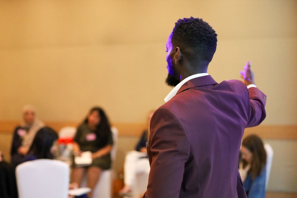 Emmanuel Awoyelu addressing an audience at a speaking engagement